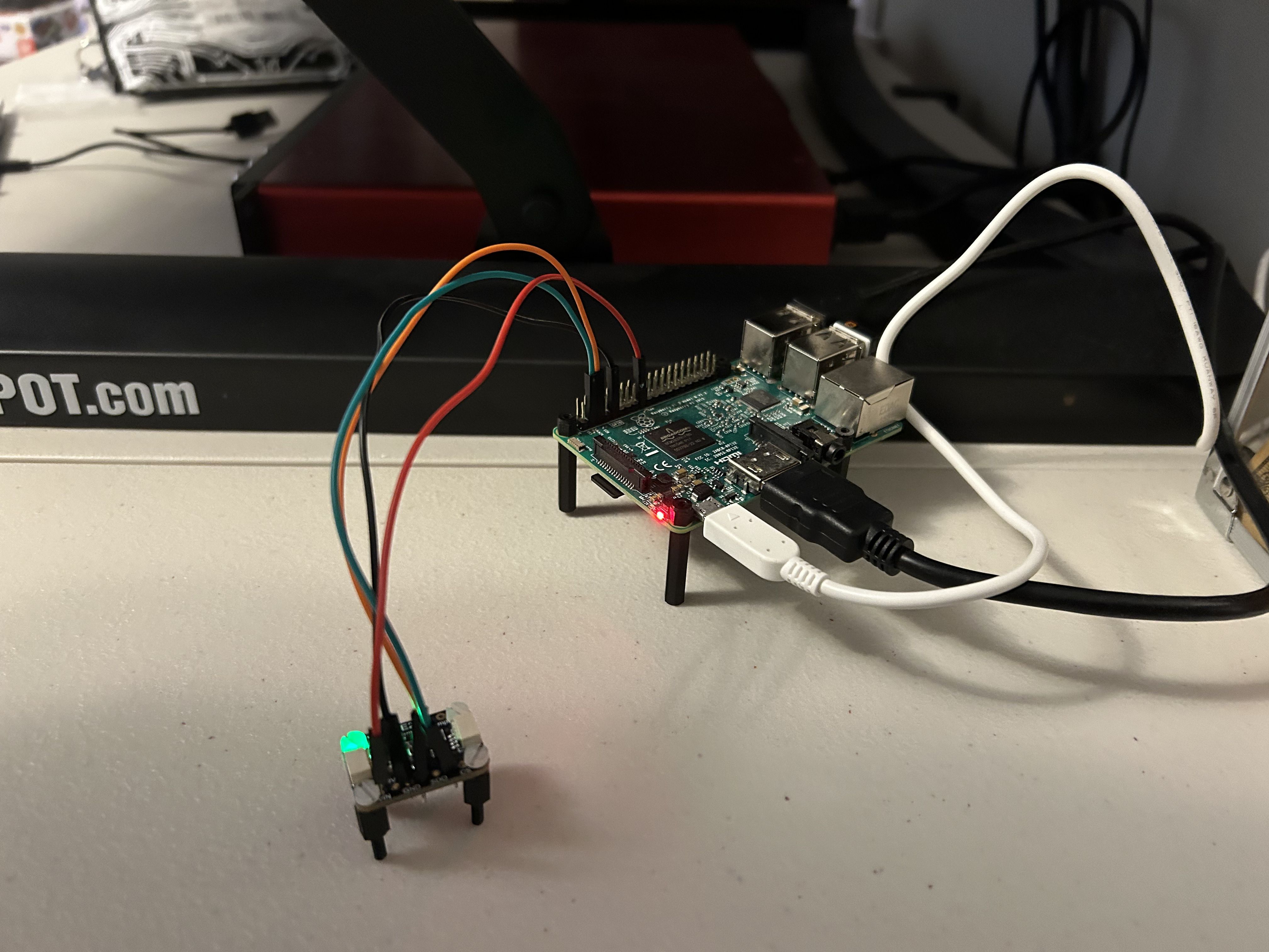 A Raspberry Pi model 3B+ with connected temperature-and-pressure sensor